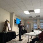 Moderator Dr. Greg Finch leads the community discussion